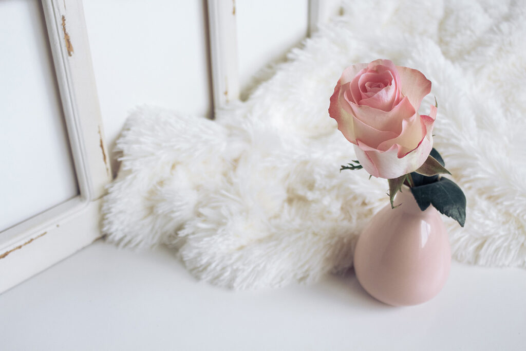 Pink Flowers next to a fur rug