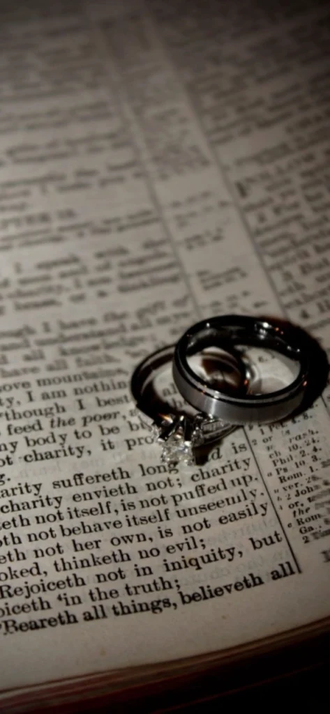 Wedding rings placed over 1 Corinthians 13 scripture for Divine Union marriage post